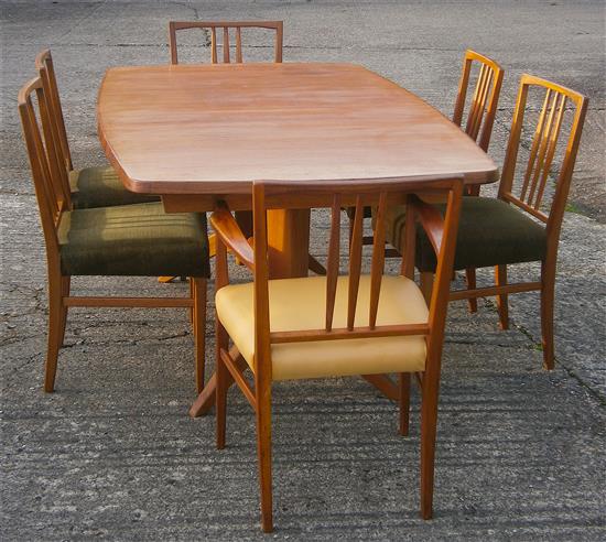 Gordon Russell, extending teak dining table with ten chairs including two carvers W.230cm